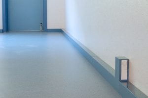 low-level electrical wall trunking with power outlet in commercial interior
